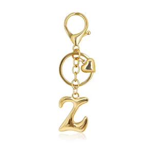 Detailed view of a golden bubble letter Z keychain with a heart charm and lobster clasp.