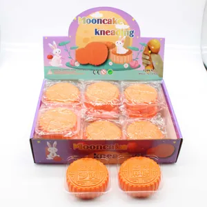 Detailed view of mooncake squishy stress relief toys in a 12-piece display box packaging