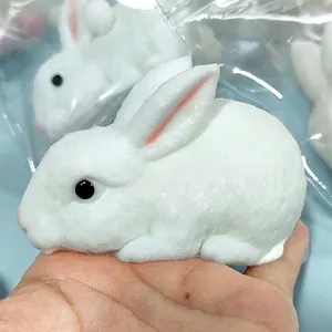 Realistic white rabbit squishy toy for stress relief and slow rebound feature.