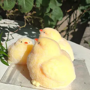 Detailed macro view of yellow fluffy chick squishy stress relief toys in sunlight