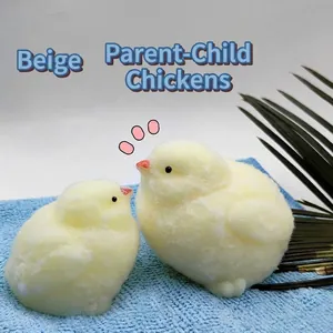 Macro view of plush cream colored mother and baby chick squeeze toys for stress relief