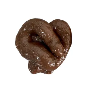 Realistic brown poop squishy toy for prank and stress relief on white background