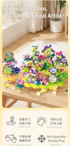 Detail view of DIY flower garden building toy showing colorful petals and accessories