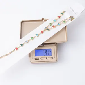 Close-up view of heart pendant necklace weighing 7.41 grams on a professional scale