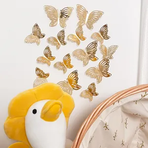 Detailed macro view of 3D mirrored rose gold butterfly wall stickers on a white wall