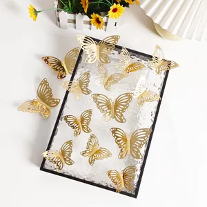 Close-up of golden 3D hollowed-out butterfly wall stickers for party wall decor