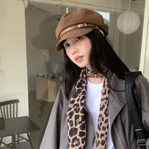 Stylish vintage wool newsboy cap for women in brown finish with leather strap detail