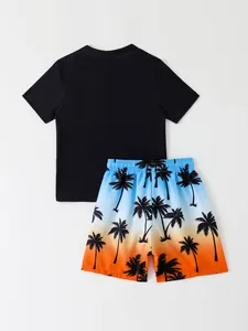 Back view detail of boys two-piece swimsuit featuring palm tree gradient beach shorts