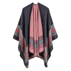 Close-up detail of the thick reversible knit striped open-front poncho shawl for women