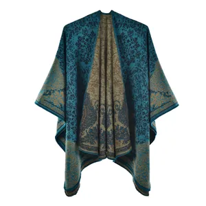 Detailed view of the intricate vintage paisley pattern on a teal and brown warm shawl