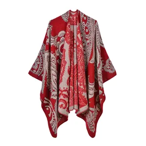 Detailed view of elegant red paisley patterned double-sided split shawl poncho blanket