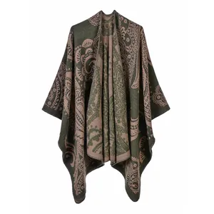 Detailed view of a double-sided split poncho with an elegant paisley pattern in olive green.