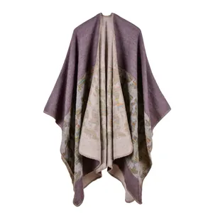 Detail view of a double-sided knit shawl poncho showing the purple and beige texture