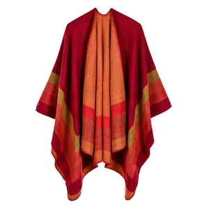 Elegant double-sided split poncho featuring a warm striped pattern and cozy knit shawl