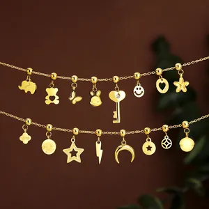 Detailed macro view of multiple gold stainless steel DIY charms for jewelry making
