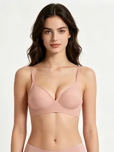 Front view of a pink seamless wireless bra with soft support and U-shaped neckline