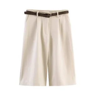 Detail view of women's beige high-waisted casual shorts with brown textured belt.