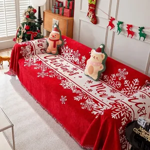Funda de sofá navideña roja con detalles de copos de nieve y Merry Christmas