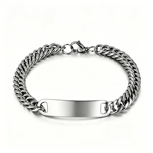Close-up of polished stainless steel Cuban chain bracelet with blank ID plate