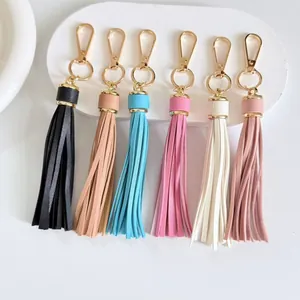 Selection of colorful 10cm faux leather tassel keychains with gold lobster clasps