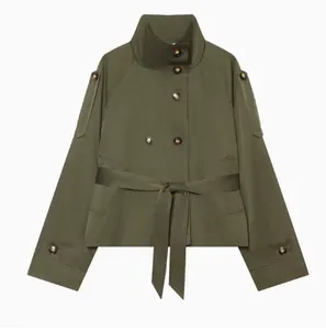 Detail view of army green short trench jacket with double-breasted buttons and belt.