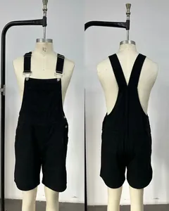 Front and back view of men's black denim overall shorts on a mannequin