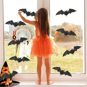 Detail view of 3D black bat wall stickers applied to a window for Halloween room decoration