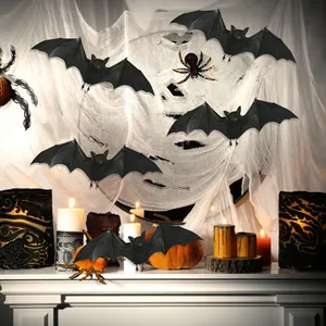 Spooky Halloween fireplace decor featuring 3D realistic black bats on tattered cloth