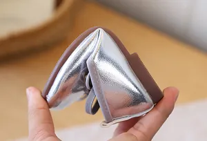 Detail view showing the high flexibility of silver metallic girl's princess shoes