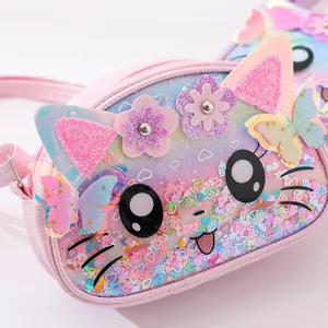 Close-up of a pink glittery cat-shaped TPU crossbody bag for children with 3D floral details.