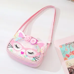 Close-up view of a pink cat-themed children's crossbody bag with glitter sequins and ears