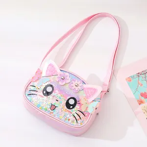 Close-up of a pink cartoon cat crossbody bag with glitter and butterfly details