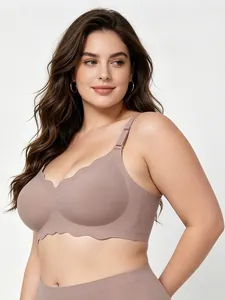Detailed view of taupe plus-size seamless bra with scalloped wave edge design