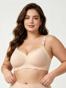 Detail shot of a plus size nude seamless bra with elegant wavy edges on a model
