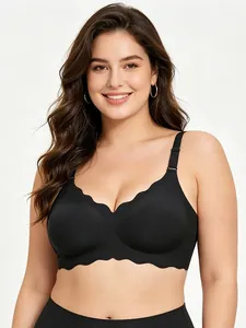 Close-up detail of a comfortable black plus size seamless bra with scallop edges