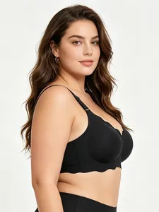 Close-up side view of a black plus size seamless bra with wavy edges on model