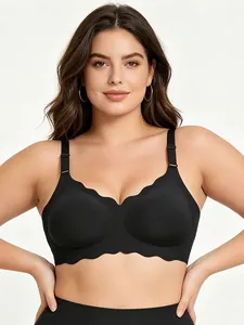 Front view of black plus size seamless bra with scalloped edges on a studio model