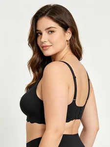 Plus size seamless black bra with stylish scalloped wave edges and adjustable straps.