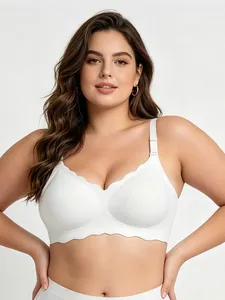 Front view of plus size seamless white bra with decorative scalloped wavy edge design