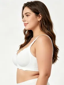 Side view of a white plus size seamless bra featuring decorative wavy scalloped edges