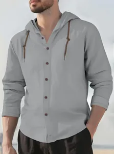 Macro view of a grey men's hooded long sleeve pure cotton shirt with a casual fit