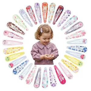 Set of colorful patterned snap hair clips arranged in a circle for little girls