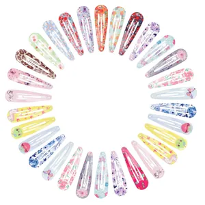 Detailed view of colorful patterned snap hair clips for girls in various designs