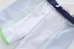 Detail view of boys' swimwear showing the breathable mesh lining and drawstring waist