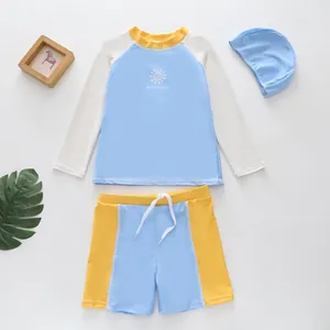 Boy's quick-dry swimwear set featuring a blue long-sleeve top and yellow shorts.