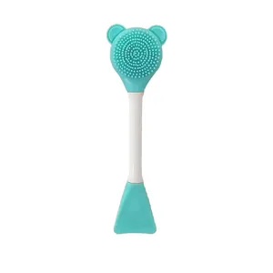 Dual-head mint green silicone facial cleansing brush with cute bear ears and spatula