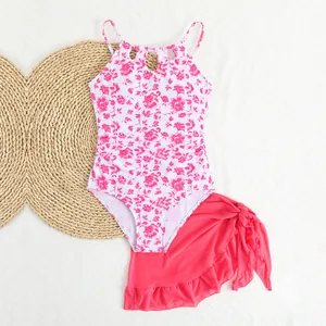 Girls' white and pink floral one-piece swimsuit set with coordinating mesh wrap skirt