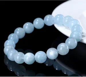 Close-up of premium natural starlight aquamarine round beaded bracelet with glossy finish