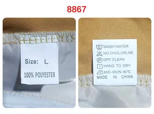 Detail view of the garment wash tag showing 100% polyester material and care icons.