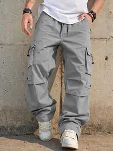 Men's grey techwear parachute cargo pants with loose wide-leg fit and utility pockets